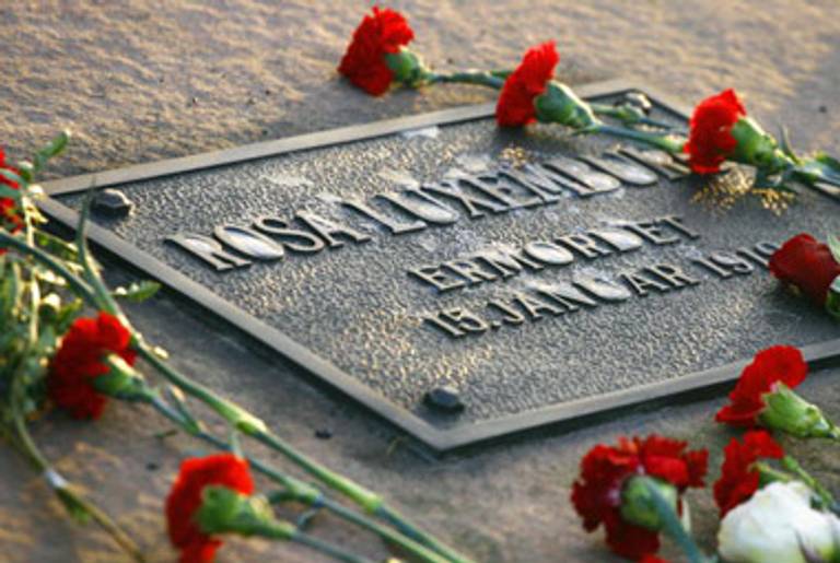 Flowers are laid at a memorial plaque in Berlin for Luxemburg.(Johannes Eisele/AFP/Getty Images)