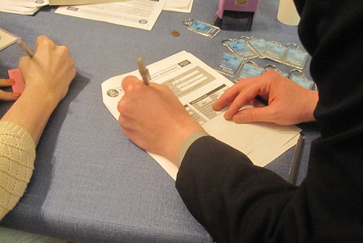 Couples sign halakhic pre- and post-nuptial agreements at Chevra Ahavas Yisroel in Crown Heights, N.Y. on March 29, 2015. (Photo by the author)