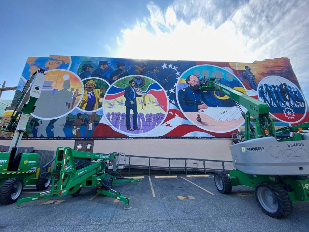 Finishing touches are applied to the Juneteenth Legacy Project mural in Galveston