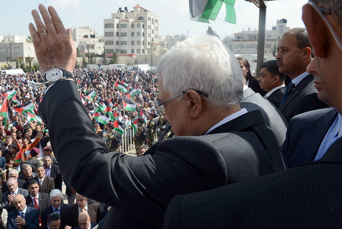Palestinian President Mahmoud Abbas greets supporters in Ramallah following his trip to Washington, D.C. on March 20, 2014.(Thaer Ghanaim/PPO via Getty Images)