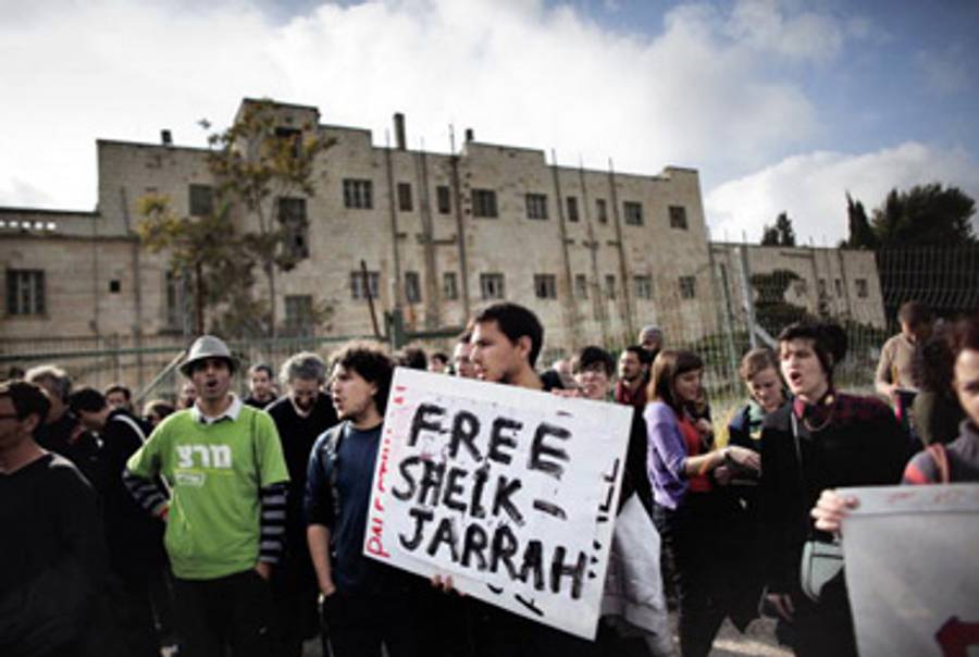 Israeli, Palestinian, and international activists protest in the Sheikh Jarrah neighborhood of East Jerusalem, March 26, 2010.(Marco Longari/AFP/Getty Images)