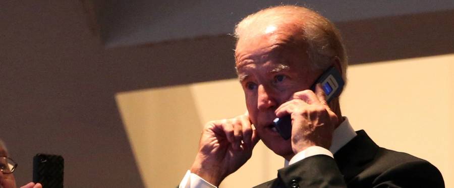 U.S. Vice President Joe Biden talks on a cellphone in Charlotte, North Carolina, September 4, 2012. 