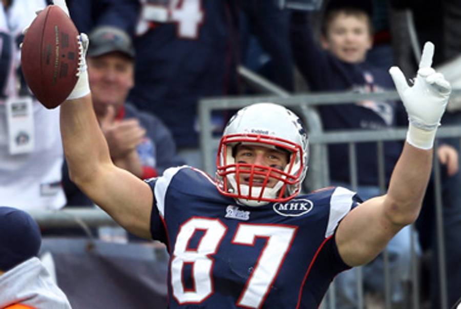 Rob Gronkowsi celebrates his 14th touchdown of the year yesterday.(Elsa/Getty Images)