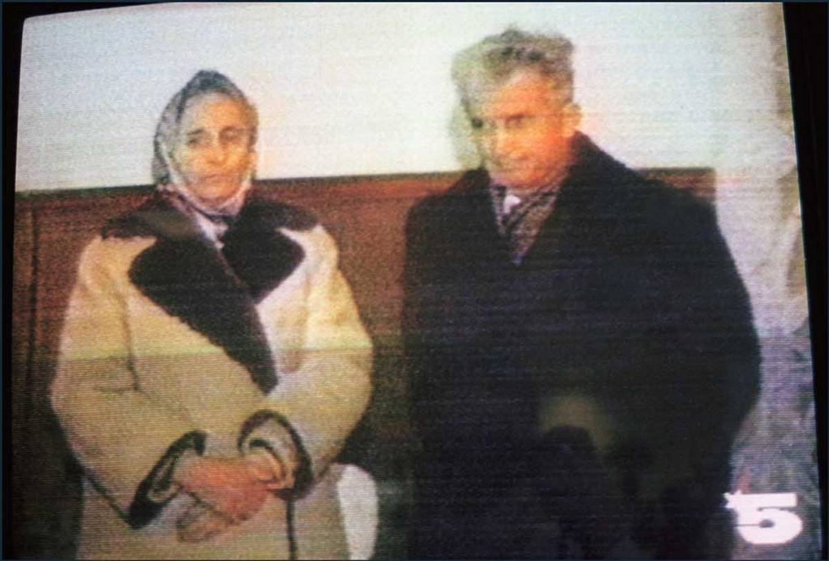 Elena Ceauşescu and her husband, ousted Romanian Communist Party General Secretary and President Nicolae Ceauşescu, face TV cameras during their trial, Dec. 25, 1989, in Bucharest (Photo: AFP via Getty Images)