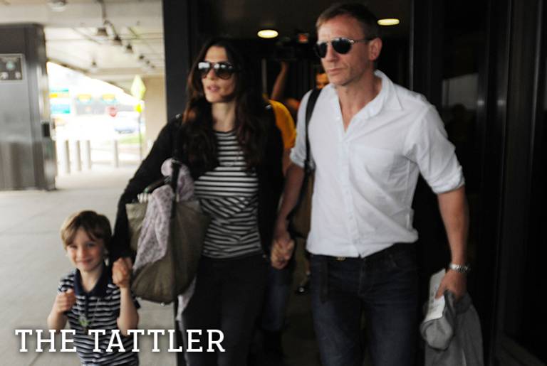 Daniel Craig, Rachel Weisz, and her son Henry arrive at Newark airport on a British Airways flight from London. (Jason Winslow/Splash News)