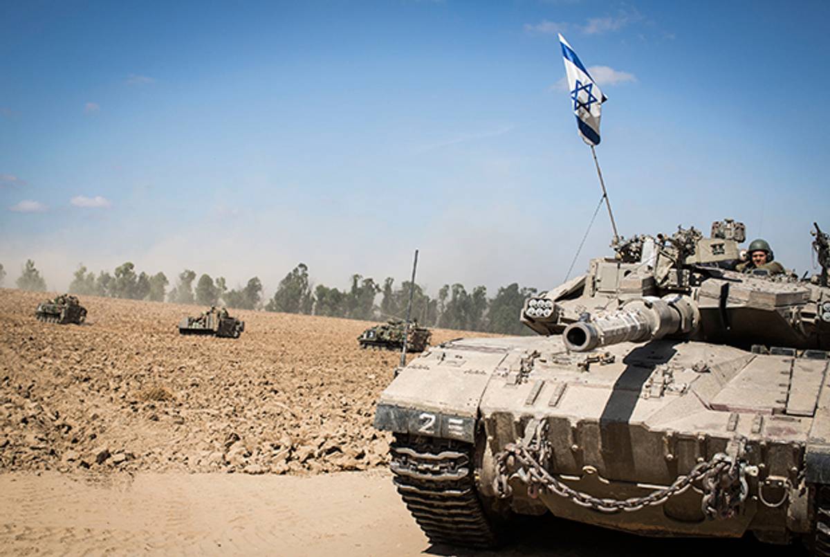 An Israeli tank maneuvers at the border with Gaza on July 18, 2014 near Sderot, Israel. (Ilia Yefimovich/Getty Images)
