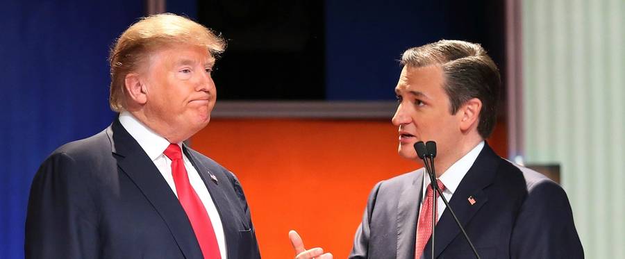 Republican presidential candidates Donald Trump (L) and Sen. Ted Cruz (R-TX) speak during a commercial break at the Fox Business Network Republican presidential debate in Charleston, South Carolina, January 14, 2016. 