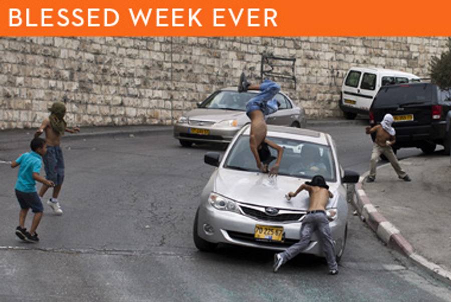 David Be’eri’s car hitting Palestinain youths in the East Jerusalem neighborhood of Silwan on October 8, 2010.(Ilia Yefimovich/AFP/Getty Images)