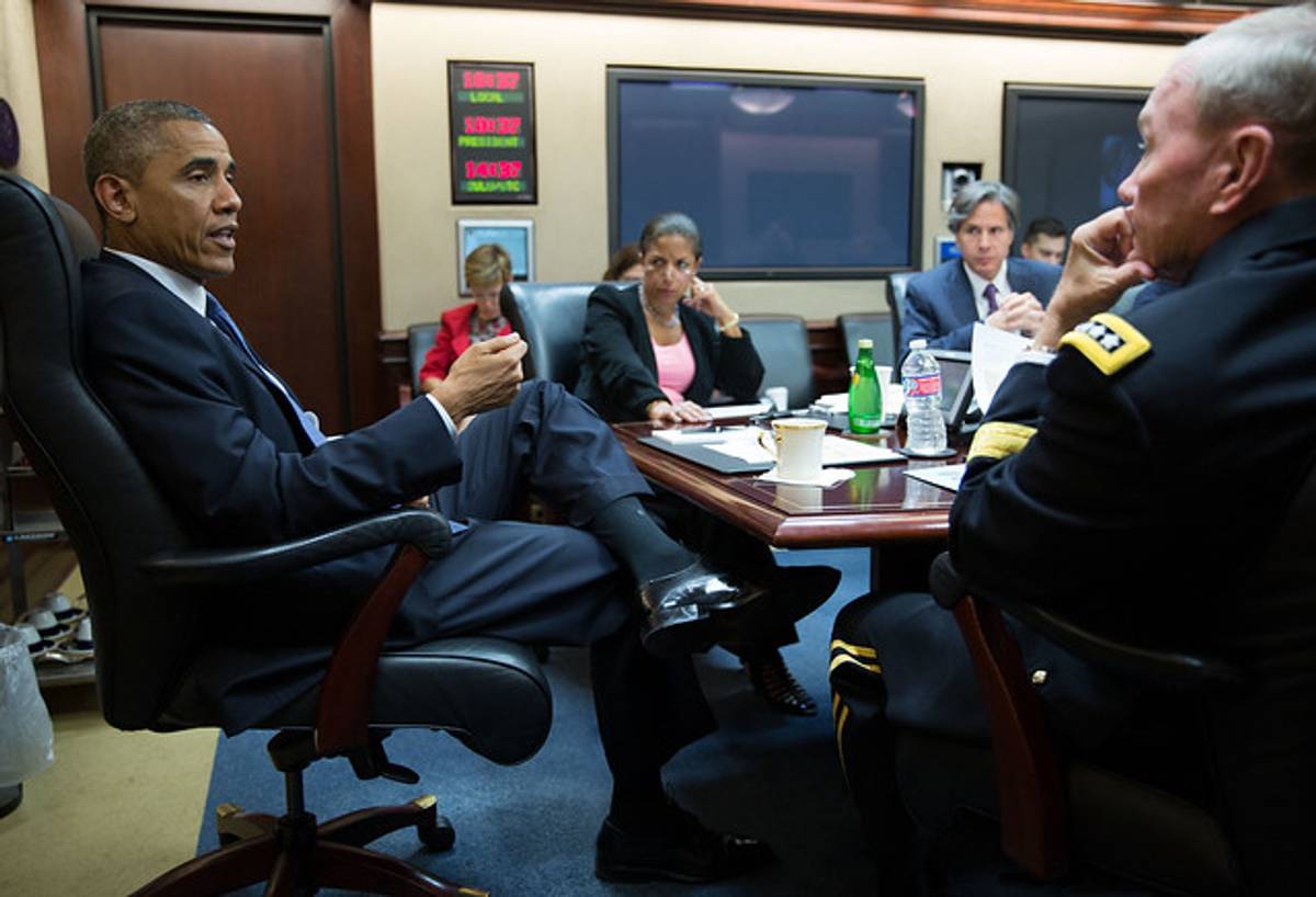 President Barack Obama meets with his national security advisers in the Situation Room of the White House, Aug. 7, 2014. 