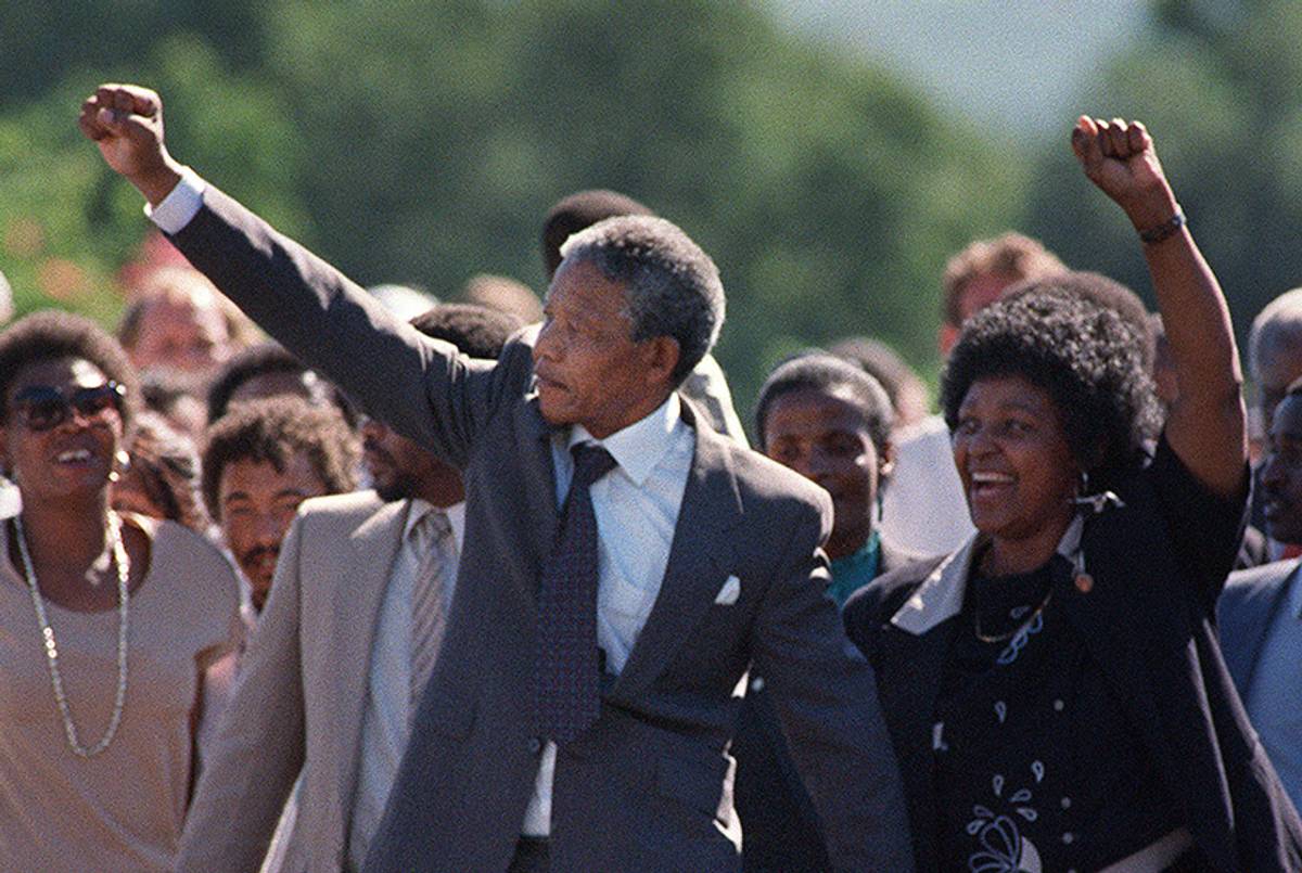 A picture taken on Feb. 11, 1990, shows Nelson Mandela and his then-wife Winnie raising their fists and saluting cheering crowd upon Mandela's release from the Victor Verster Prison near Paarl.(Alexander Joe/AFP/Getty Images)