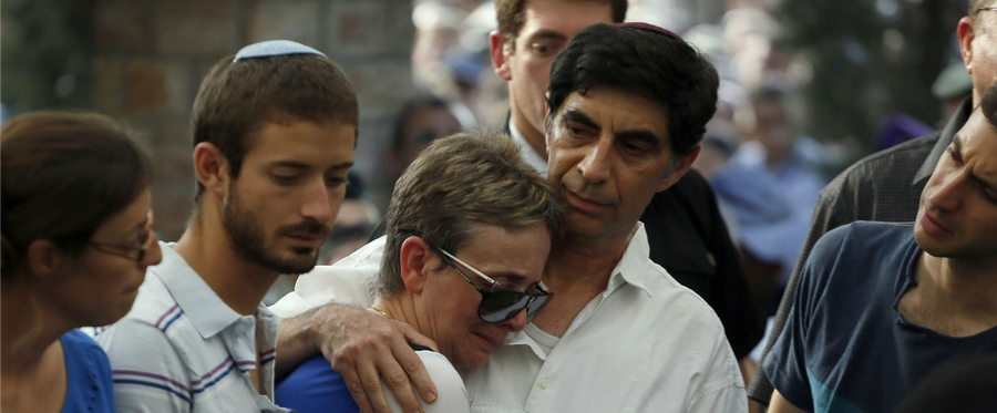 Simcha and Leah Goldin, the parents of 23-year-old Israeli Lt. Hadar Goldin, mourn during his funeral at the military cemetery in the city of Kfar Saba on August 3, 2014.