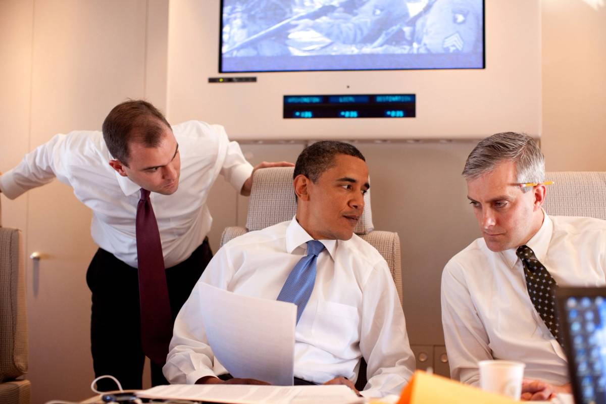 Barack Obama meets with Deputy National Security Advisor for Strategic Communications Denis McDonough (right) and speechwriter Ben Rhodes on Air Force One June 4, 2009 on route to Cairo, Egypt