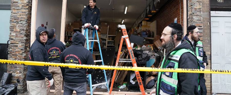 Demolition and recovery crews work at the scene of the Dec. 10, 2019, shooting at a kosher supermarket, in Jersey City, New Jersey