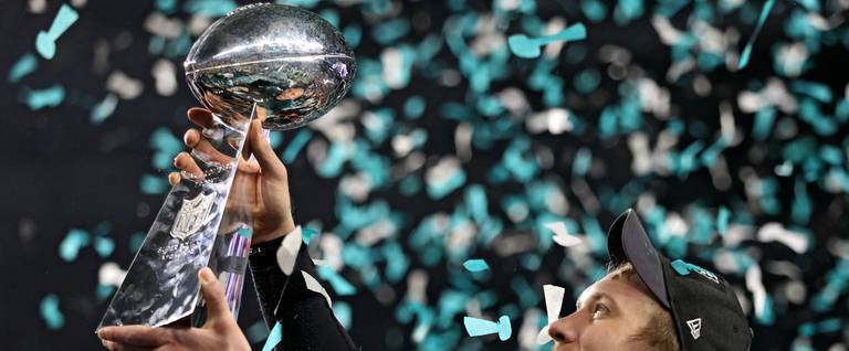 Quarterback Nick Foles #9 of the Philadelphia Eagles raises the Vince Lombardi Trophy after defeating the New England Patriots, 41-33, in Super Bowl LII at U.S. Bank Stadium on February 4, 2018 in Minneapolis, Minnesota.