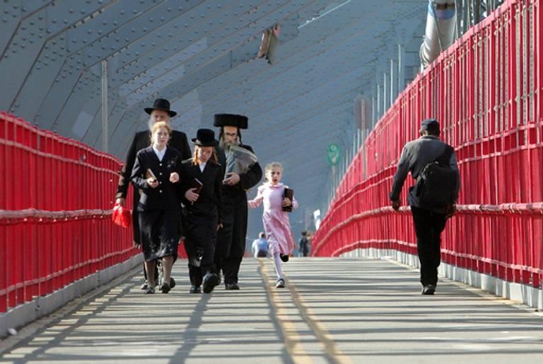 Hasidic Jews walk across the Williamsburg Bridge on Rosh Hashanah. (Mario Tama/Getty Images)