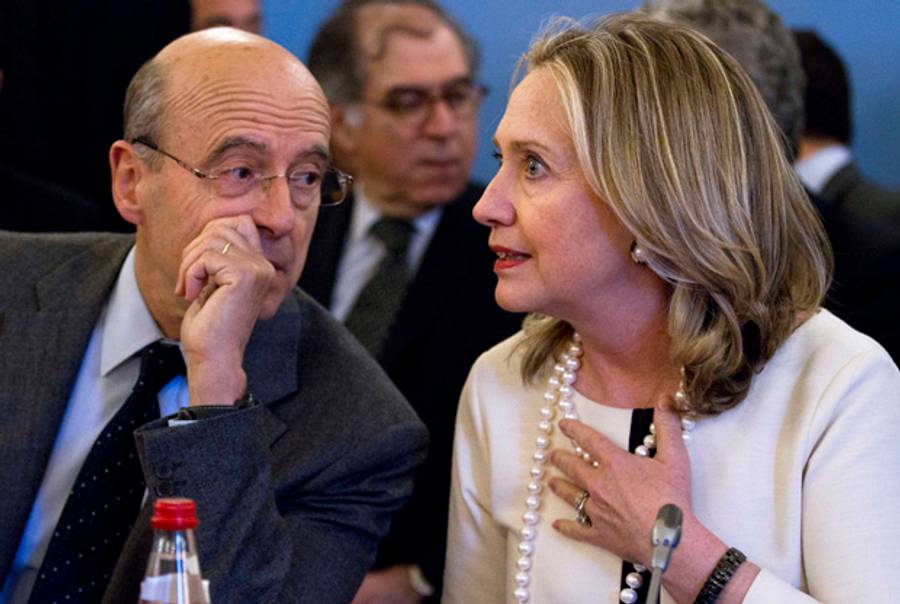 The French foreign minister and U.S. secretary of state in Paris yesterday.(Jacquelyn Martin/AFP/Getty Images)