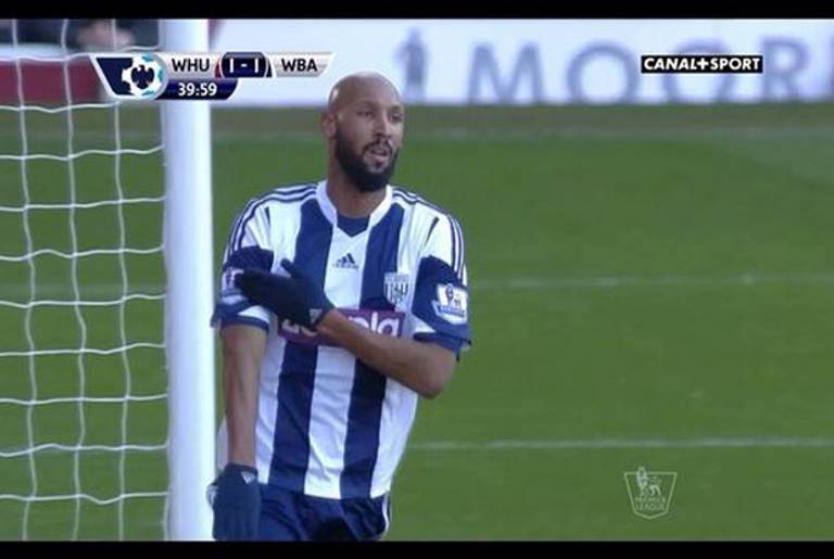 French soccer player Nicolas Anelka celebrates a goal with a controversial gesture.(World Soccer Talk)