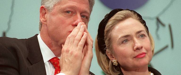 Former U.S. President Bill Clinton and his wife Hillary attend a health care ceremony at Children's Hospital in Washington, D.C., February 18, 1998. 