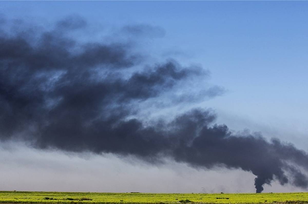 smoke rises from the coastal side of the Gaza strip following an Israeli air strike on July 30, 2014. (Getty Images)