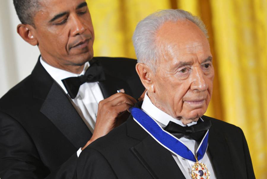 President Barack Obama presents Israeli President Shimon Peres with the Presidential Medal of Freedom June 13, 2012 at the White House in Washington, DC. (MANDEL NGAN/AFP/GettyImages)