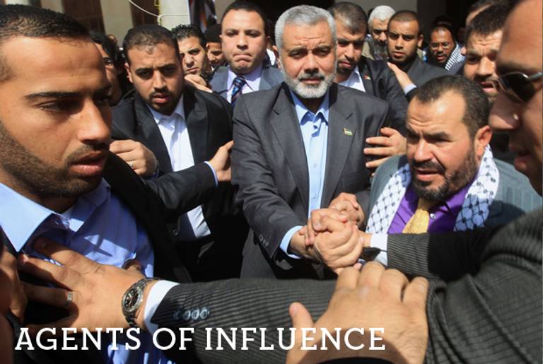Hamas' Gaza premier Ismail Haniya is surrounded by bodyguards at the Al-Azhar grand mosque in Cairo following Friday prayers on Feb. 24, 2012.(Khaled Desouki/AFP/Getty Images)