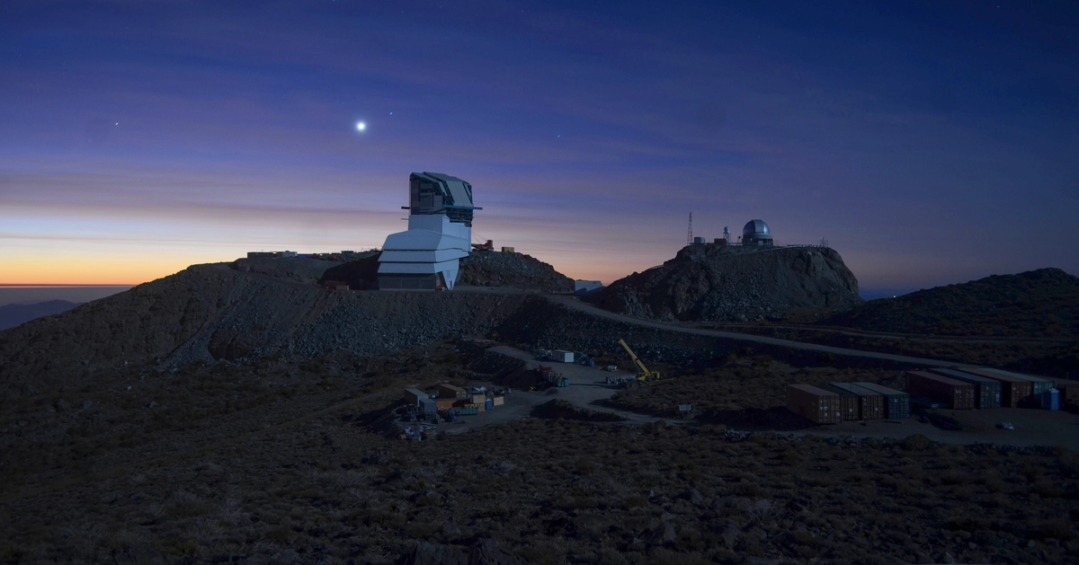 Rubin Observatory at sunset, lit by a full moon, Cerro Pachón, Chile, May 2020