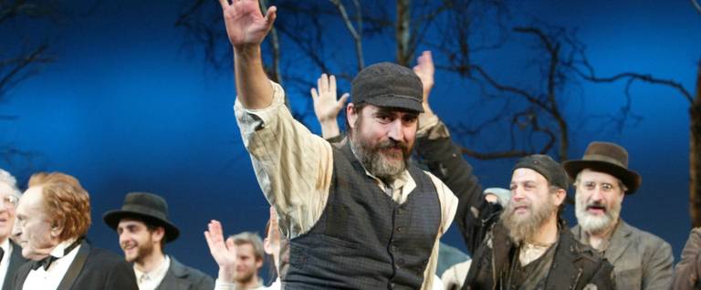 Actor Alfred Molina takes a bow at the opening night curtain call for 'Fiddler on the Roof' February 26, 2004 in New York City.