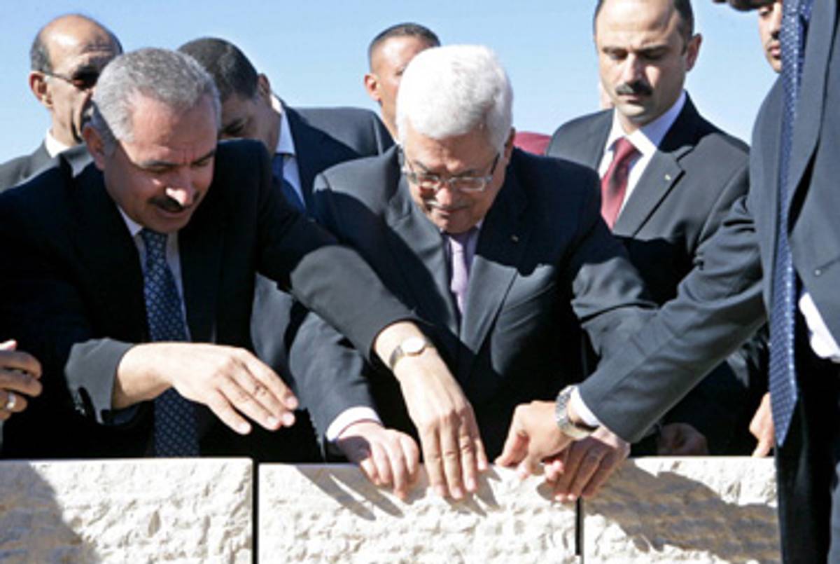 Mahmoud Abbas lays the cornerstone for the Presidential Guest Palace in Ramallah on December 1, 2010.(Thaer Ganaim/PPO via Getty Images)