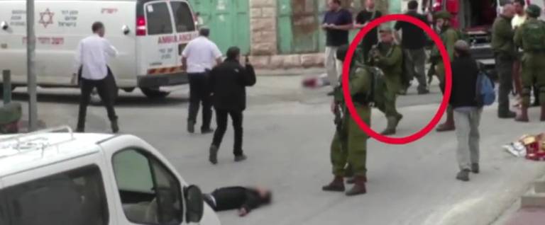 Still from a video depicting a wounded Palestinian knife-wielding assailant shot by Israeli soldier Elor Azaria as he lies on the ground