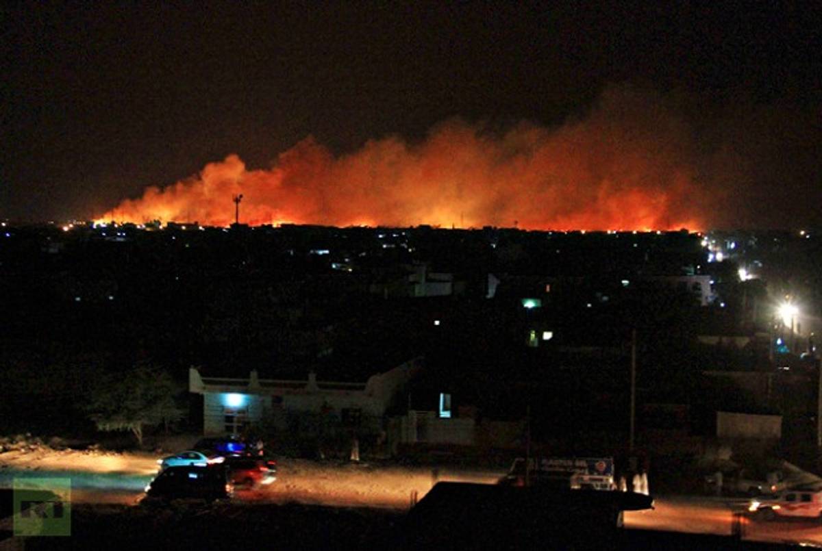 Smoke Billows Over Khartoum Following an Attack on a Weapons Factory (Reuters)