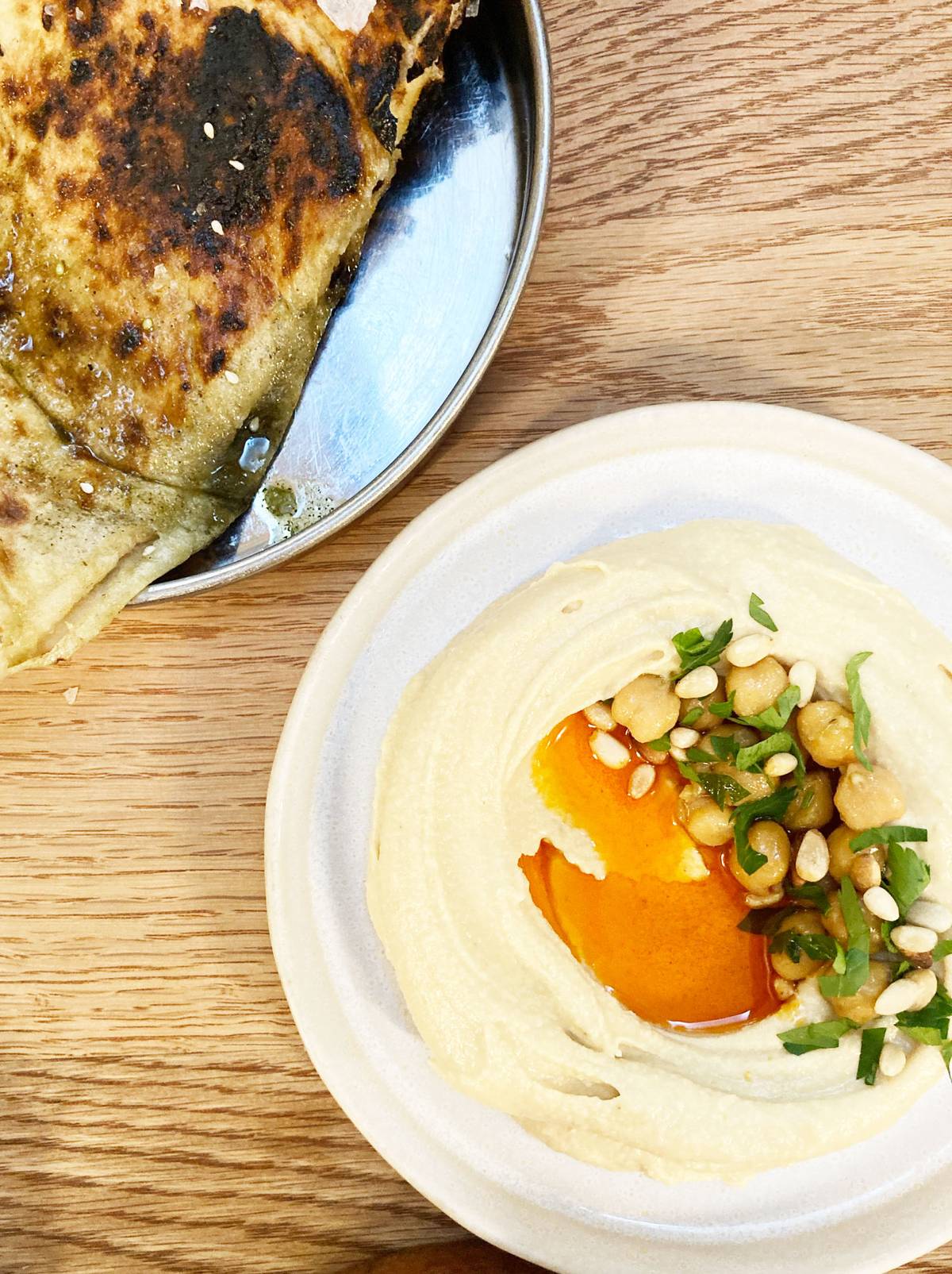 Hummus with burned butter and laffa at Bubala