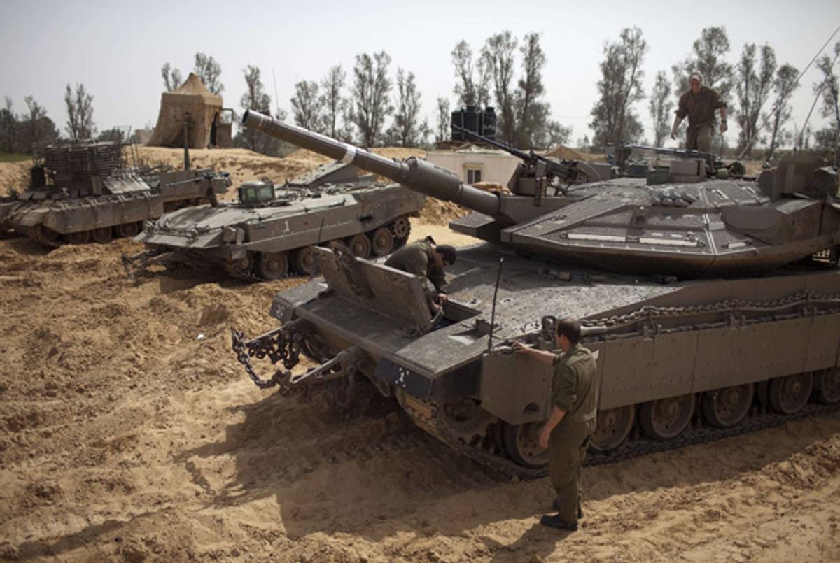 Israeli soldiers on standby along Israel's border with the Gaza Strip on March 13, 2012.(Menahem Kahana/AFP/Getty Images)