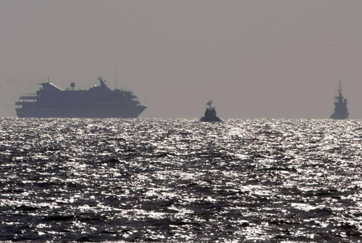 Turkish ship Mavi Marmara (L) with Israeli troops on board approaches the southern port of Ashdod on May 31, 2010. (MENAHEM KAHANA/AFP/Getty Images)