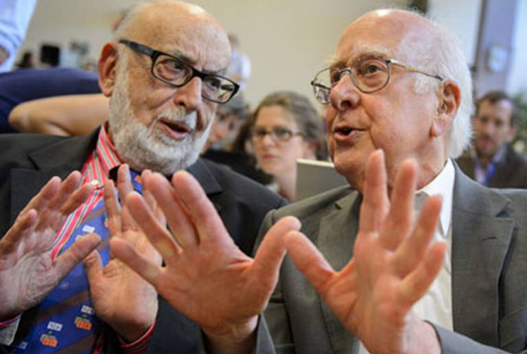 British physicist Peter Higgs (right) speaks with Belgium physicist Francois Englert.(Fabrice Coffrini/AFP/Getty Images)