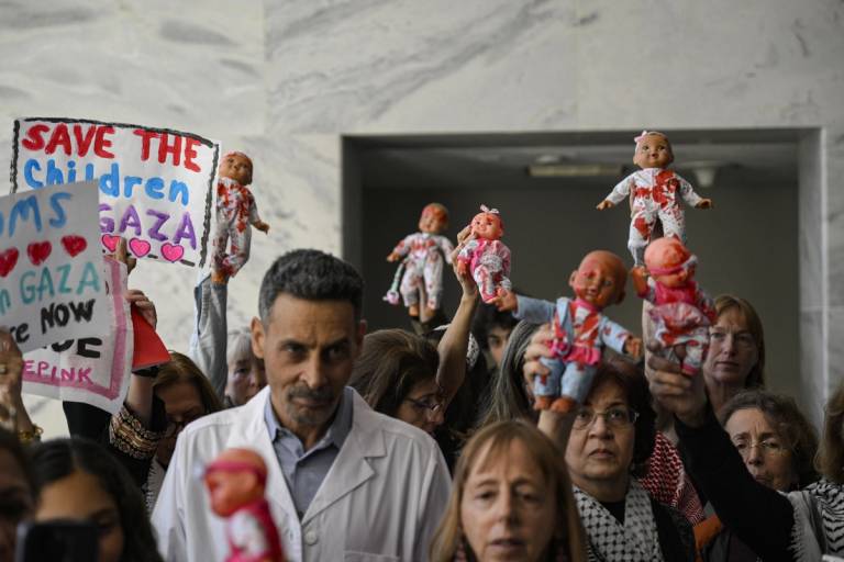 Activists from Doctors Against Genocide, American Palestinian Women's Association, and CODEPINK hold a demonstration calling for an immediate cease-fire in Gaza at the Hart Senate Office Building in Washington, D.C., Nov. 16, 2023