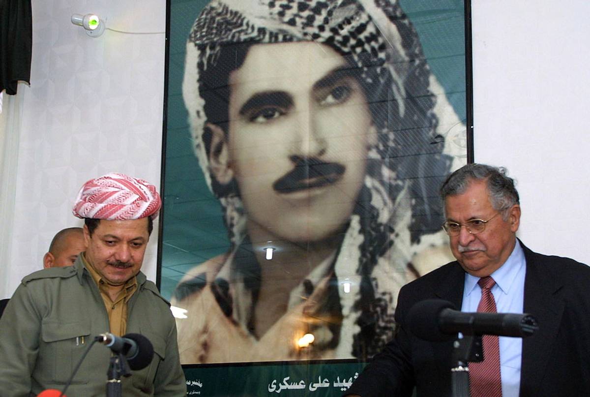 Masoud Barzani (left) and Jalal Talabani attend a joint press conference following their meeting in the city of Dukan, some 300 kms northeast of the Iraqi capital Baghdad, 2003. (Photo: Behrouz Mehri/AFP/Getty Images)