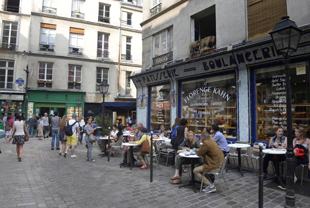 People sit outside the'Florence Kahn pastries shop on July 12, 2013 in the Rue des Rosiers, the Jewish area of the Marais district in Paris.(MIGUEL MEDINA/AFP/Getty Images)