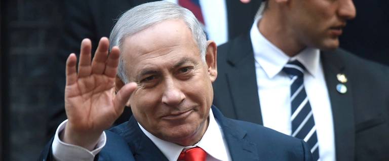 Israel's Prime Minister Benjamin Netanyahu waves to the press as he meets with Prime Minister Boris Johnson at 10 Downing Street on Sept. 5, 2019, in London