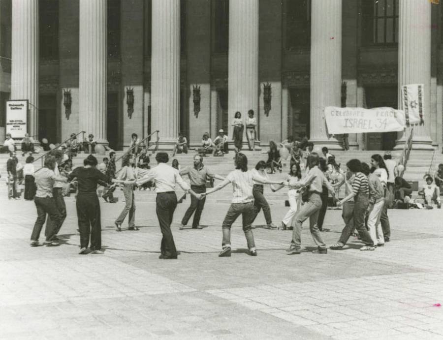 The Hillel Israeli folk dance group gathered in front of Northrop Auditorium on the University of Minnesota campus, 1982