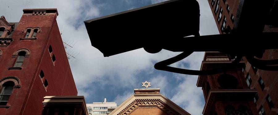 A security camera hangs across the street from the Park East Synagogue, March 3, 2017, in New York City
