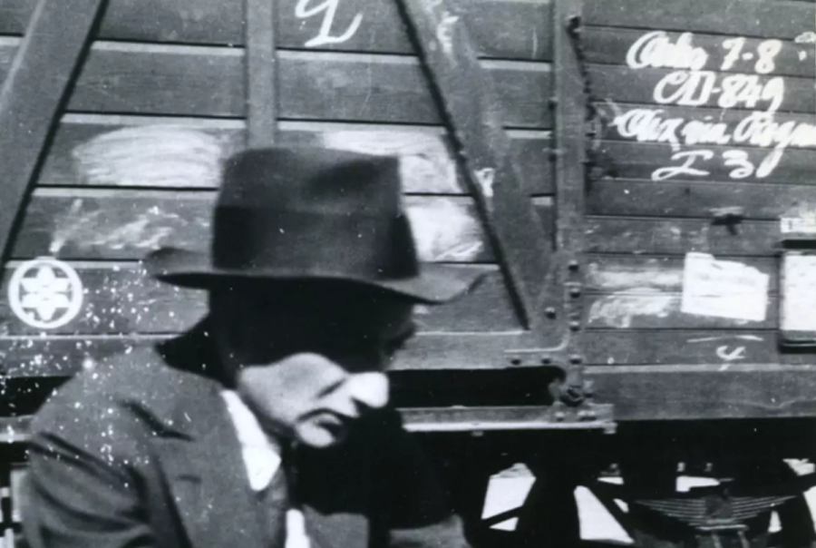 Joseph Roth waiting on a train platform while traveling in France, 1926