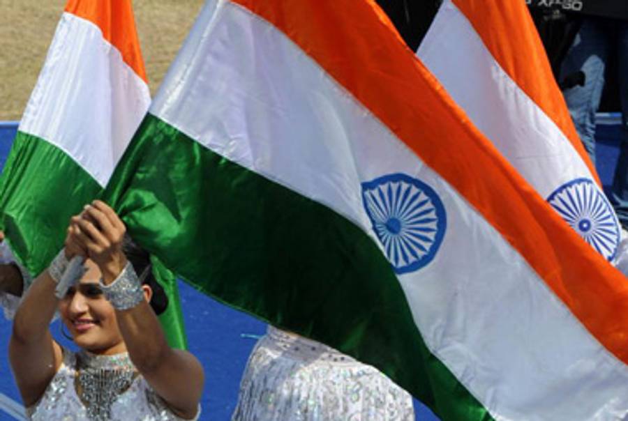 Waving the Indian flag.(Noah Seelam/AFP/Getty Images)