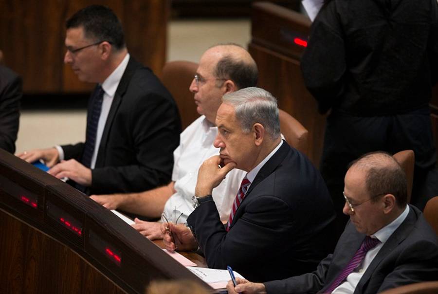 Israeli Prime Minister Benjamin Netanyahu attends a special Knesset (Israeli parliament) session to swear in Avigdor Lieberman as Israel's foreign minister on November 11, 2013 in Jerusalem, Israel. Lieberman was acquitted on corruption charges by the Magistrates Court in Jerusalem last week after a long-running trial.(Uriel Sinai/Getty)