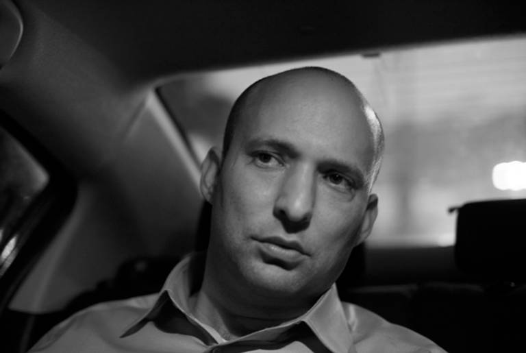 Naftali Bennett, head of the Habayit Hayehudi Party, the Jewish Home party, sits in his car during a campaign tour on Dec. 26, 2012 in Tel Aviv, Israel. (Uriel Sinai//Getty Images)
