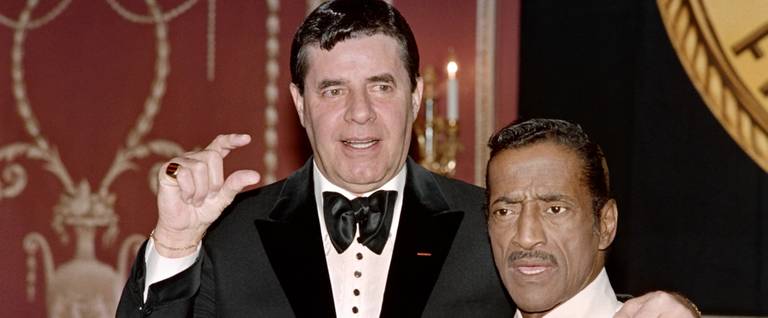 Jerry Lewis (L) and Sammy Davis, Jr. at the New York Friars Club in New York City, May 15, 1988. 