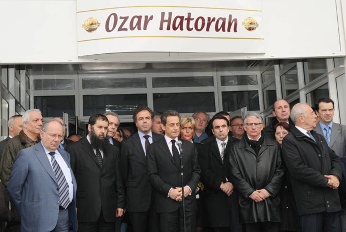 Several eminences, including President Sarkozy and Toulouse Mayor Pierre Cohen, outside the high school today.(Eric Cabanis/AFP/Getty Images)
