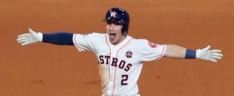 Alex Bregman #2 of the Houston Astros celebrates after hitting a game-winning single during the tenth inning against the Los Angeles Dodgers in game five of the 2017 World Series at Minute Maid Park on October 30, 2017 in Houston, Texas.