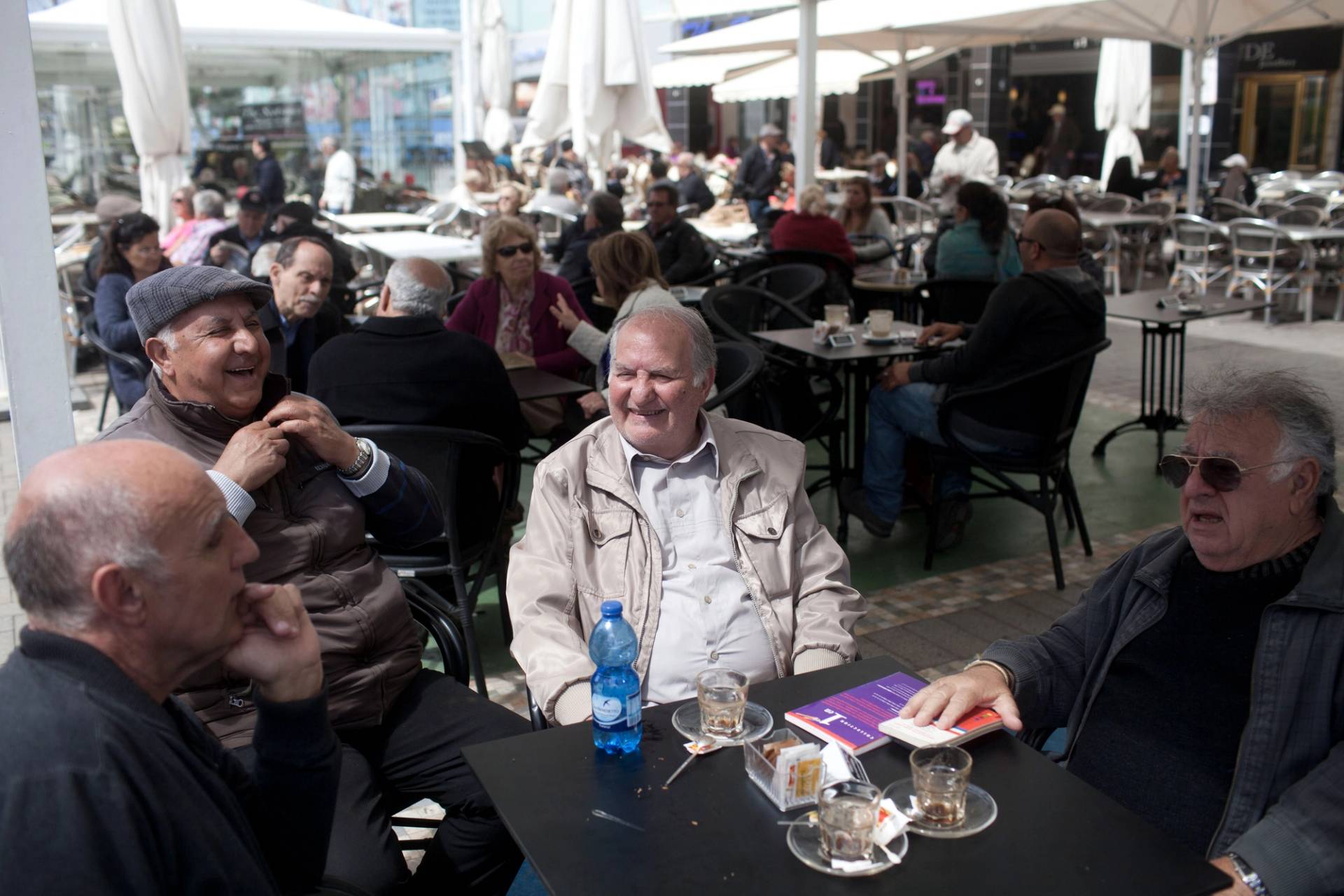 Members of the French community sit in a coffee shop in Netanya, Israel, on March 12, 2015