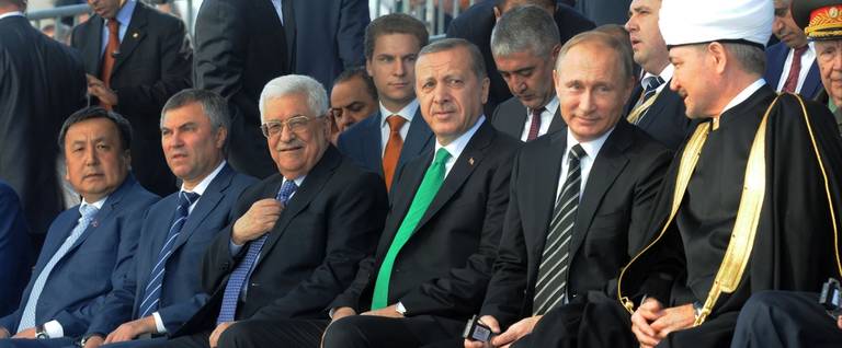 In this handout image supplied by the Palestinian President's Office (PPO), Russian President Vladimir Putin (R), Turkish President Tayyip Erdogan (C), Palestine's President Mahmoud Abbas (L) and Russian Grand Mufti Ravil Gainutdin attend an opening ceremony for the newly restored Moscow Cathedral Mosque on September 23, 2015 in Moscow, Russia.