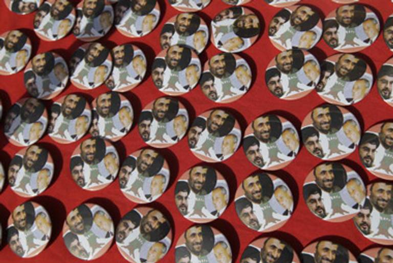Pins, bearing portraits of Hezbollah chief Hassan Nasrallah, Iranian President Mahmoud Ahmadinejad, and Lebanese Parliament Speaker Nabih Berri, for sale in the southern Lebanese border town of Bint Jbeil last month.(Joseph Eid/AFP/Getty Images)